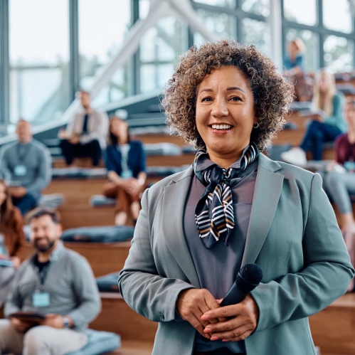 Proud older student in front of class